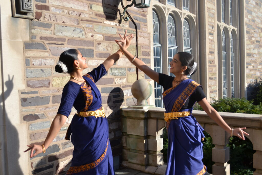 Anika Mehrotra '28 and Jaya Choudhary '28 posing with crossed diagonal hands