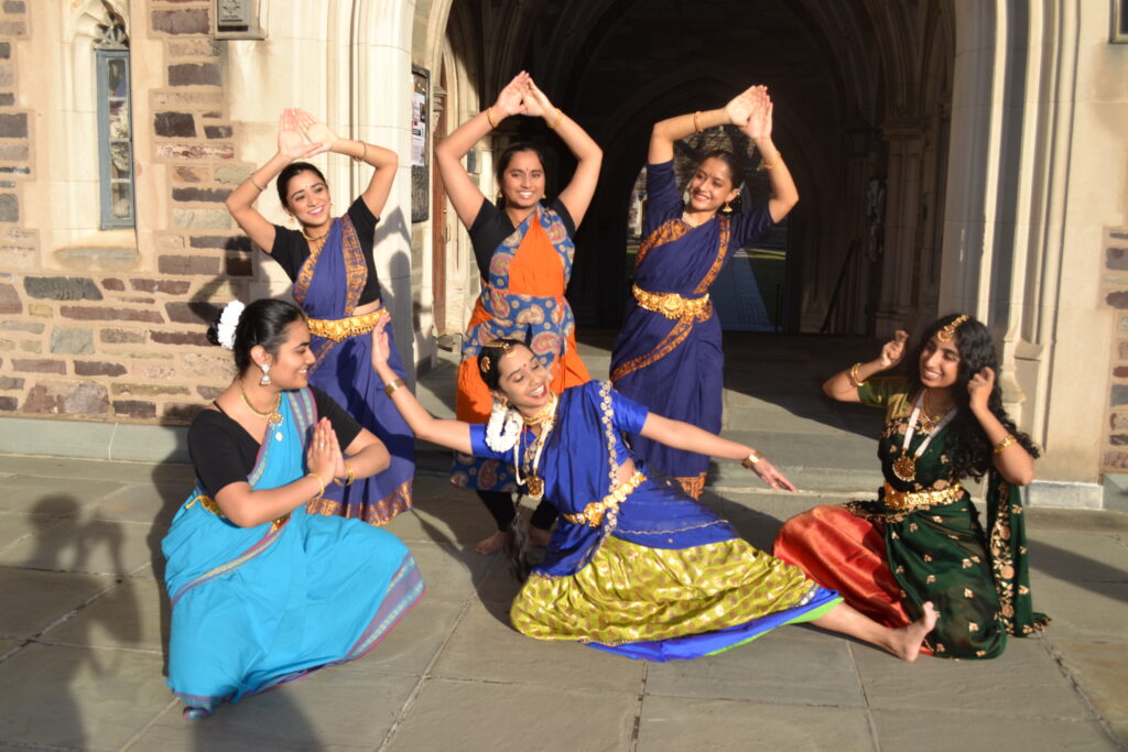 Aashna Pandey '27, Samyukta Neeraj '25, Vibha Srinivasan '26, Anika Mehrotra '28, Paroma Chowdhury (GS), Jaya Choudhary '28 in a pose with sleeping Shiva surrounded by snakes