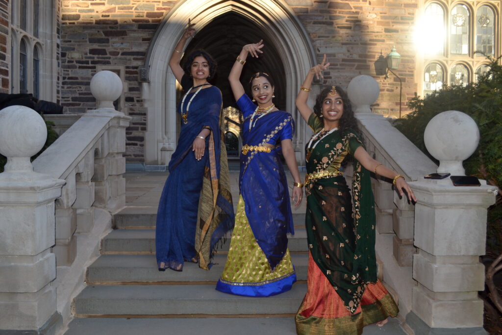 3 dancers posing on the steps