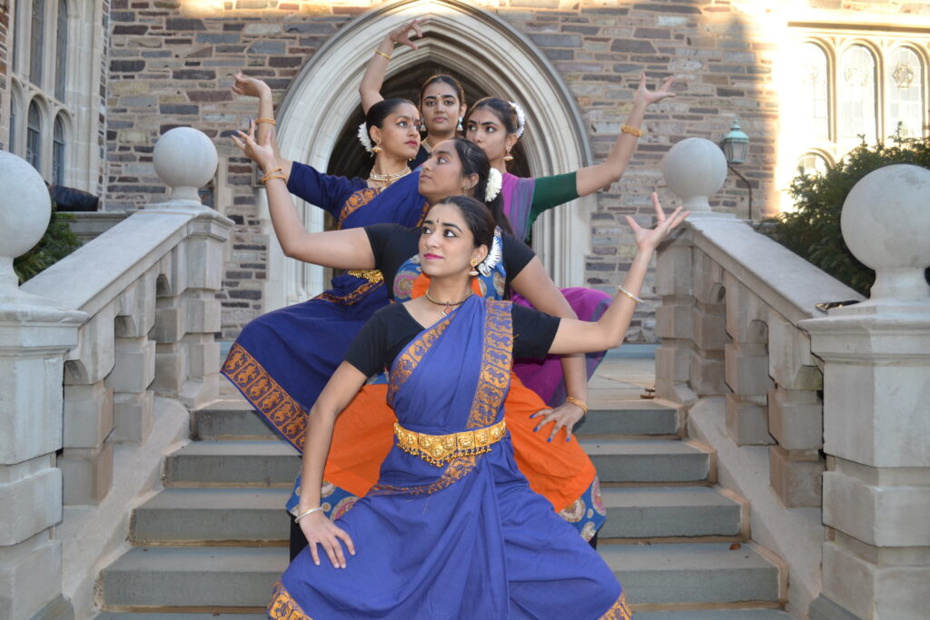 five dancers posing as the many hands of shiva