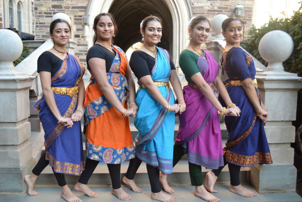 five dancers smiling